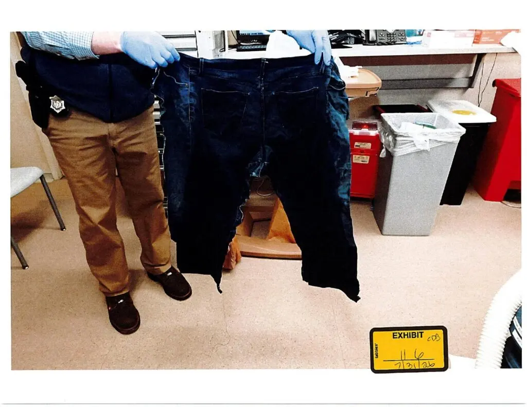 Exhibit 116, an uncropped photograph of cut blue jeans showing broad pale and blue mottled areas across the fabric